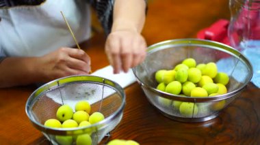A woman who takes a calyx of plum