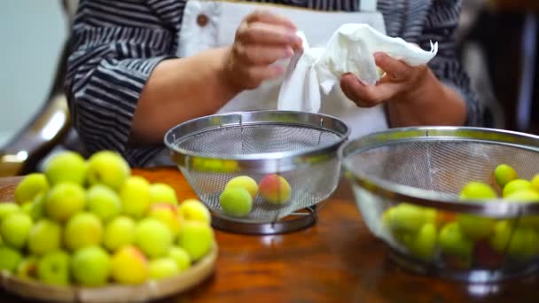 Woman Who Drains Washed Plums — Video Stock