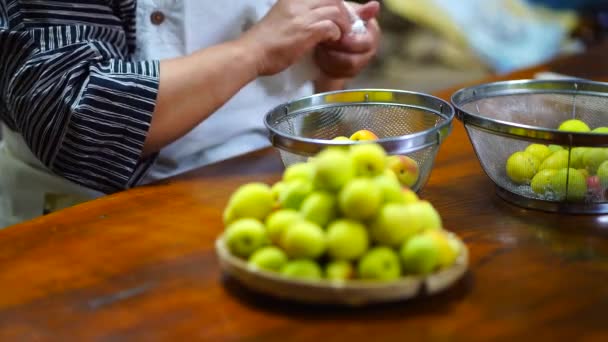 Woman Who Drains Washed Plums — Vídeo de stock