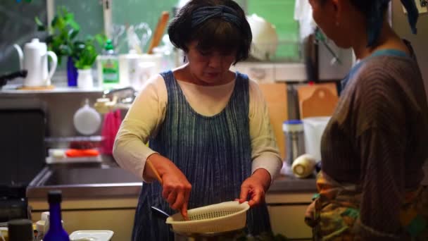 Woman Rubbing Boiled Plums — Stok video