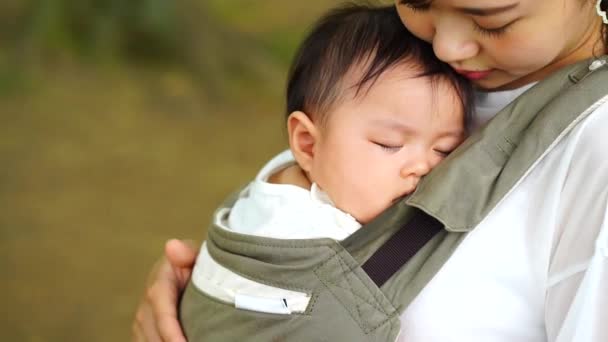 Mother Holding Sleeping Child — ストック動画