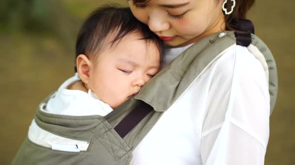 Mother Holding Sleeping Child — Stockvideo