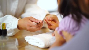 Image of a girl doing nails