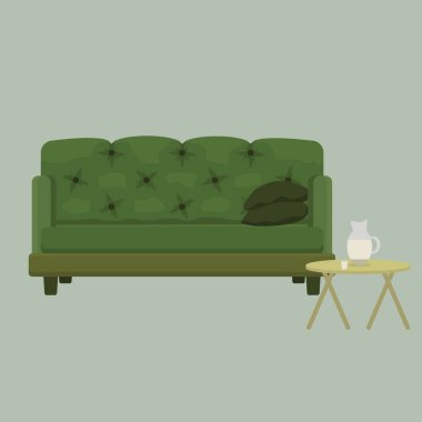 Deri bir kanepe ve bir sürahi su ve bir bardak kahve sehpası.