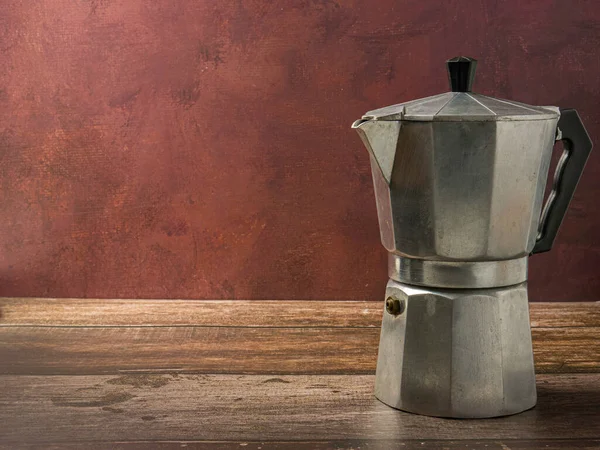 Moka pot on wood table for hot drink concept