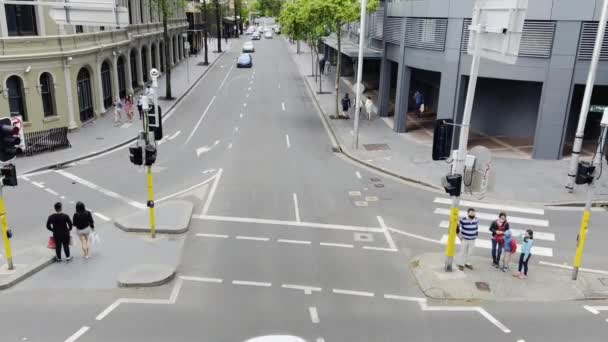 Overhead shot of Multi-ethnic group of people crossing a road on a pedestrian crossing in Sydney, road safety. — 图库视频影像