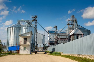 Building Exterior, Storage and drying of grains, wheat, corn, soy, sunflower against the sky