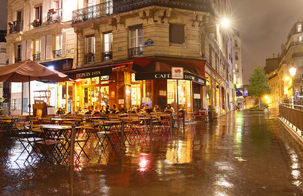 Paris, France-October 01, 2021 : The French traditional restaurant Cave La Bourgogne located in Latin quarter at night, Paris, France.