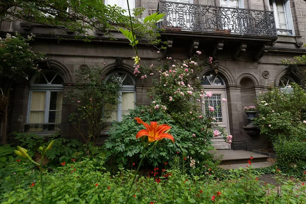 Old mystic stone house is surrounded by the wild garden.