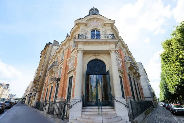 The facade of traditional French house with typical balconies and windows. Versailles , France.