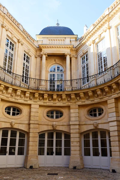 The historic building of Paris Administrative Court of Appeal . It was built in 1654 for Catherine of Beauvais, the listed monument is packed with trompe-l oeil and faux symmetries.