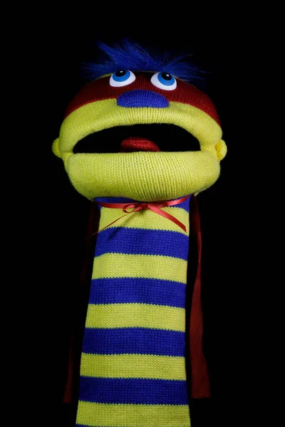 Sock Puppet Isolated Against Black Backgroun