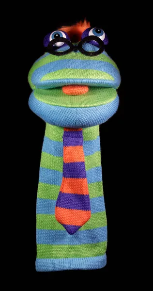 Sock Puppet Isolated Against Black Background