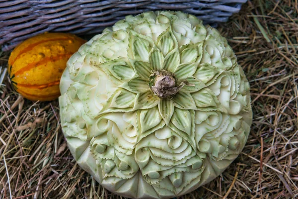 decorated pumpkin. carvings in a decorative pumpkin. Harvest festival. Craftsmanship. Food beautifully served. Photo from the meal