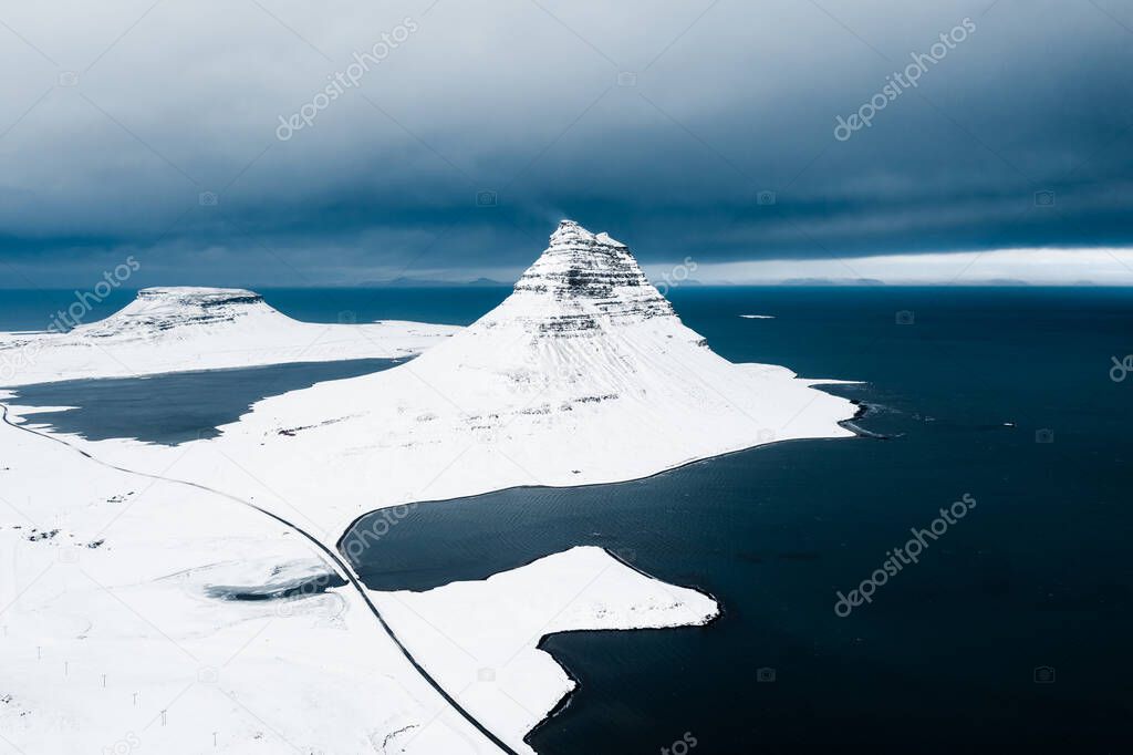 Kirkjufell, Church Mountain, Iceland's Snfellsnes Peninsula covered by snow during winter,a mountain rising above the sea