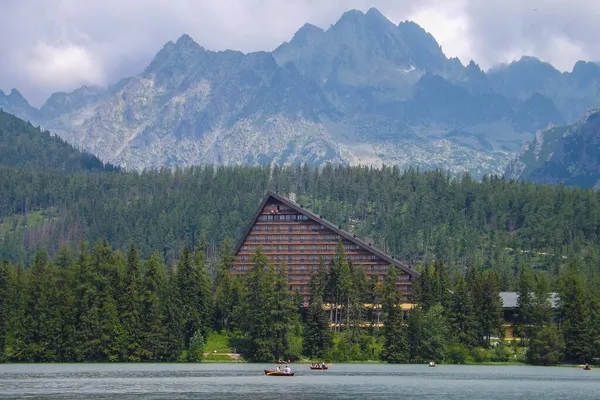 Mountains- the best place for recreation, relax. Outdoor activities in nature, hiking, swimming,kayaking. Hotel in mountains with tourists, High Tatras, Slovakia