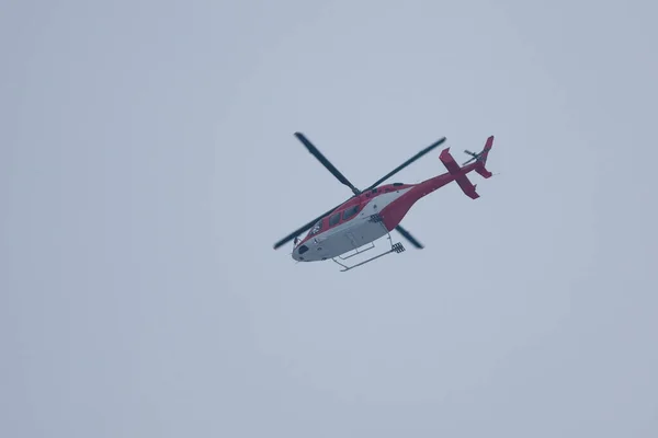 Rescue emergency helicopter in air, useful for news or articles