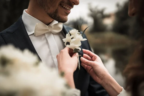 Flowers on the groom\'s jacket, wedding ceremony