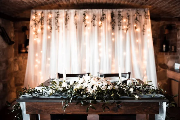 Beautiful wedding room with wedding table with food, flowers and drinks, decorations,