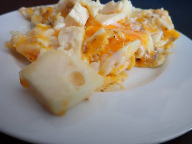 scrabbled eggs with vegetales served on a plate for breakfast