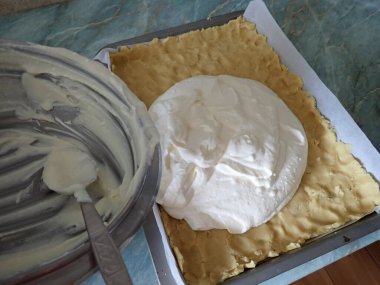 homemade preparation of a sweet cheesecake in kitchen