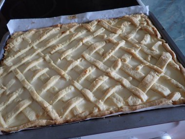 homemade preparation of a sweet cheesecake in kitchen