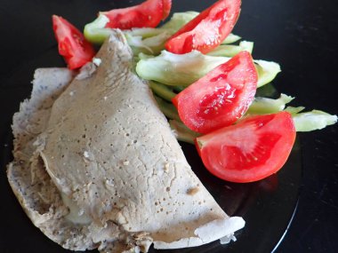 portion of salty vegetable pancakes vith cheese