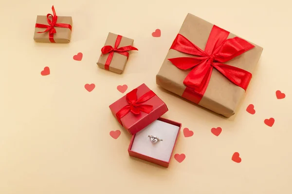 Ring Large Stone Box Next Gifts Red Ribbons Beige Background — Stock Photo, Image
