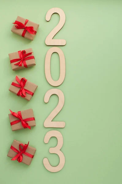 Numbers 2023 Green Background Next Small Gifts — Stock Photo, Image