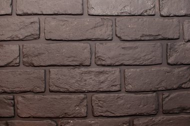 texture of a black brick wall with a solid background