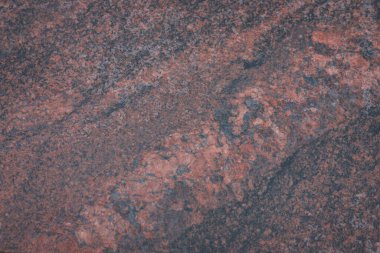 Kesilmiş granit levhanın nadir bulunan bir rengi. Harika cilalanmış kırmızı kahverengi taş. Madde dekorasyon, duvar ve kapı yüzeyleri için kullanılabilir. Doğal taş mermer granit arkaplan dokusu