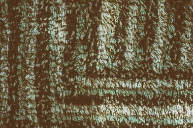 Yakın çekim yeşil renkli kumaş dokusu. kahverengi ve yeşil kumaş desen tasarımı veya döşeme soyut arka planı
