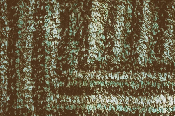 Yakın çekim yeşil renkli kumaş dokusu. kahverengi ve yeşil kumaş desen tasarımı veya döşeme soyut arka planı