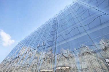 La Samaritaine luxury department store and its new undulating glass facade designed by studio SANAA, view from Rue de Rivoli