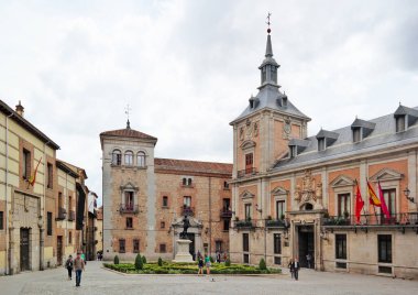 Madrid, Spain - May 2018: Casa de la Villa in Villa Square (Plaza de la Villa) the City Hall of Madrid with tourist walking on a spring day