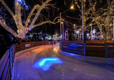  Vienna, Austria, Dec. 2019:  People ice-skating at Christmas World on Rathausplatz, traditional Christmas Market in Vienna 