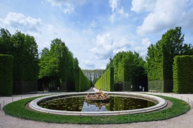 Paris, France - May, 2022:  Gardens of the famous Palace of Versailles. whole site have unique fountains, ponds, lake and landscapes built in 17th century