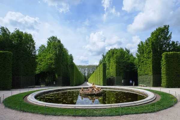Paris, France - May, 2022:  Gardens of the famous Palace of Versailles. whole site have unique fountains, ponds, lake and landscapes built in 17th century