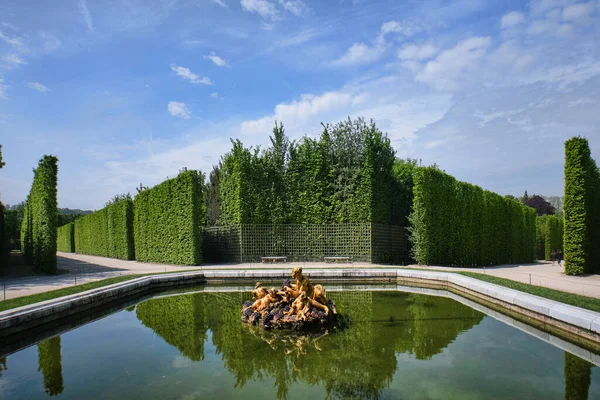 Paris, France - May, 2022:  Gardens of the famous Palace of Versailles. whole site have unique fountains, ponds, lake and landscapes built in 17th century