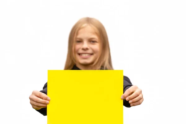 Smiling Girl Holds Blank Yellow Sheet Paper Isolate White Background — Stock Photo, Image