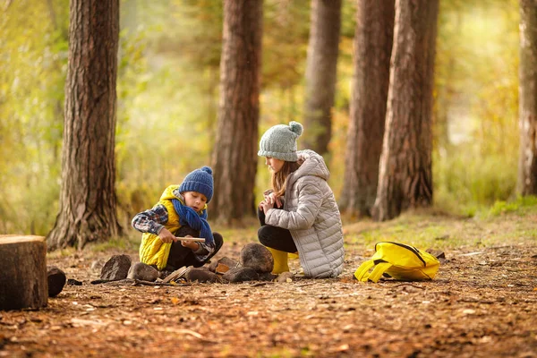 Boy Girl Lighting Fire Forest Yellow Background Autumn Leaves Background — Stock Photo, Image