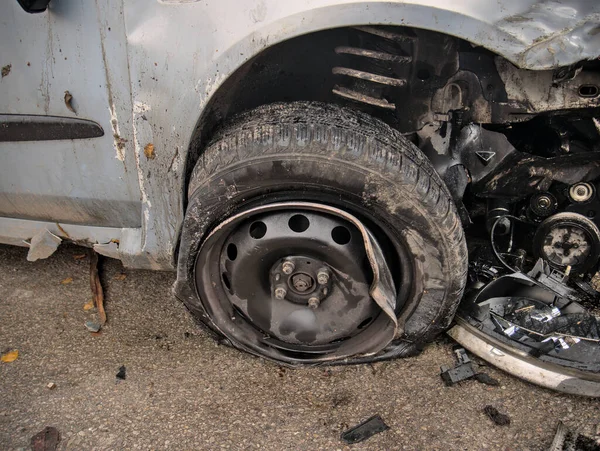 The broken wheel of a car smashed in a car accident
