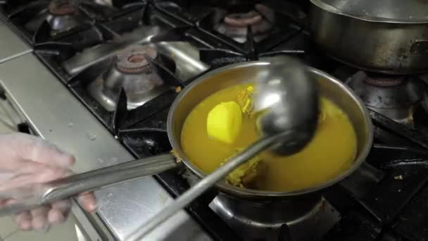 Mans Hands Cooking Stewing Potatoes Fish Frying Pan Pouring Sauce — Vídeo de stock