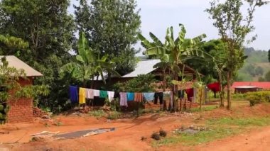 Clothes are being dried, hanging on the rope after laundry in African village.. High quality FullHD footage
