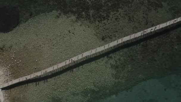 Epic Aerial View Drone Shot Long Thin Bridge Shore Ocean — Video