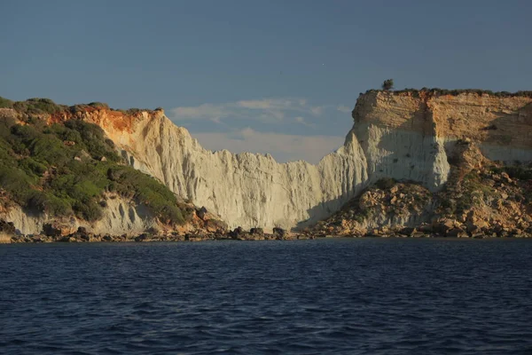 Rocky mountain shore and deep blue sea. High quality image.