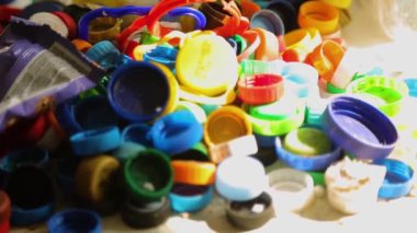 Many multicolored plastic caps, recycling purposes. High quality FullHD footage