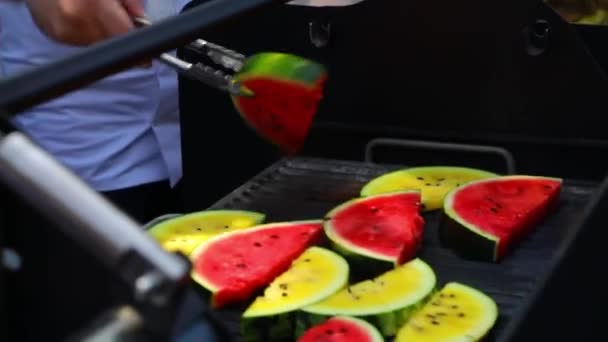 Man Turning Grilled Watermelon Upside Red Yellow Watermelon Cooking High — Stockvideo