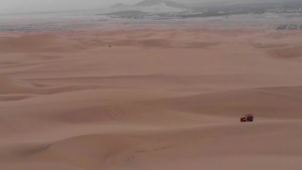 Buggy Jeep Driving Huge Desert Dunes Smooth Drone Aerial Shot — Video