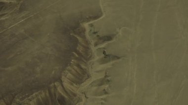 Aerial shot from airplane of mysterious Nazca desert lines, group of geoglyphs..